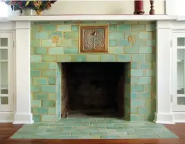  ??  ?? LEFT (top to bottom) Recalling California patterns of the 1920s-30s, this backsplash by Native Tile has crisp black trim tiles. • Lavender walls and a bold geometric floor say Jazz Age in this revival bathroom. • A fireplace installati­on in the style of Ernest Batchelder is recent work by Pasadena Craftsman Tile. ABOVE For a Belle Epoque bathroom that looks original, David Heide Design Studio used classic off-white subway tiles with a listello and bullnose cap, and hexagon mosaics for the floor.