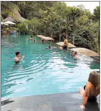  ??  ?? At the hotel Chapung Sebali, the Jungle Fish Bar is a draw for day-trippers who want to hang out at a pool in the tropical forest near Ubud.