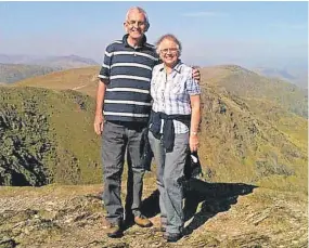  ?? ?? David and Gwen Raynor on top of the Old Man of Coniston in March 2012