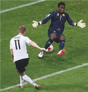  ?? AFP ?? Germany’s forward Timo Werner (left) scores his team’s third goal during the Group B match against Cameroon at the Fisht Stadium Stadium in Sochi on Sunday.