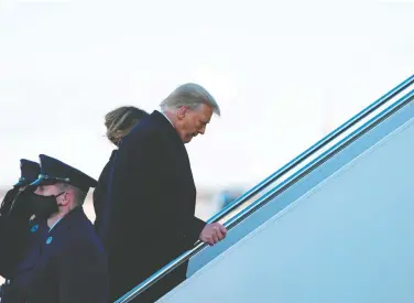  ?? ALEX EDELMAN/AFP ?? Now-former U.S. president Donald Trump and first lady Melania Trump board Air Force One at Joint Base Andrews in Maryland on their way to Florida on Wednesday. Matt Gurney says Trump was not a serious enough person for the job of president.