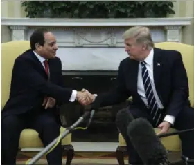  ?? THE ASSOCIATED PRESS ?? President Donald Trump shakes hands with Egyptian President Abdel Fattah al-Sisi in the Oval Office of the White House in Washington, Monday, April, 3, 2017.