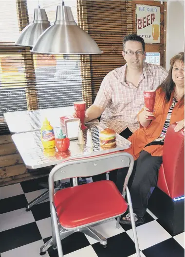  ??  ?? Roy and Debi Berriman in their diner in the shed. 152407a