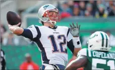  ?? AL BELLO / GETTY IMAGES / AFP ?? New England’s Tom Brady prepares to unleash a pass during the Patriots’ 27-13 victory over the New York Jets at MetLife Stadium in East Rutherford, New Jersey on Sunday.