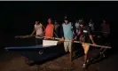  ?? ?? The Bantay Dagat bring their bangka to the water for a night patrol against illegal fishers