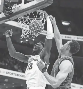  ?? CHRIS DAY/THE COMMERCIAL APPEAL ?? Grizzlies' Jaren Jackson Jr. (13) dunks the ball during the game between the Memphis Grizzlies and the Dallas Mavericks at Fedexforum in Memphis, Tenn., on March 20, 2023.