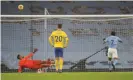  ?? Photograph: Clive Brunskill/Reuters ?? Raheem Sterling sends his late penalty high over the crossbar.