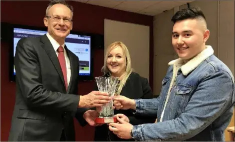  ??  ?? President of DkIT Michael Mulvey presents a prize to Spark Regionals winners, Dayna Brannigan and Gareth Lau