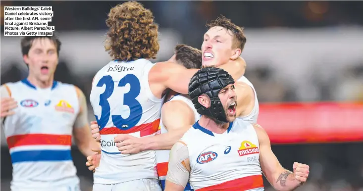  ?? Picture: Albert Perez/AFL Photos via Getty Images ?? Western Bulldogs’ Caleb Daniel celebrates victory after the first AFL semifinal against Brisbane.