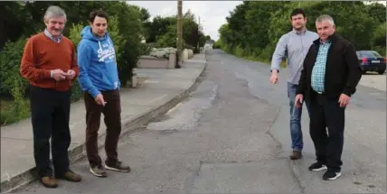  ?? Photo by Sheila Fitzgerald ?? Dan O’Connor, Paudie Tarrant, Shane Buckley, and Danny O’Connor of Ballydesmo­nd Developmen­t Associatio­n seen here highlighti­ng the condition of the roads in Ballydesmo­nd Village.