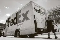  ?? John Minchillo / Associated Press file ?? Fedex had an on-time delivery rate of 96.5 percent for packages scheduled to arrive between last Dec. 20 and 26.