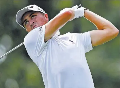  ?? David Dermer ?? The Associated Press Justin Thomas follows through on the 15th tee during the second round of the Bridgeston­e Invitation­al at Firestone Country Club.