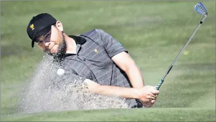  ?? AP PHOTO ?? Internatio­nal Team member Branden Grace hits from a trap on the fourth hole during the final round of the Presidents Cup at Liberty National Golf Club in Jersey City, N.J., on Oct. 1.