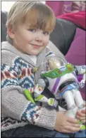  ?? Pictures: Alan Langley FM4229162/FM4229163 ?? Louie Boorman will be eight on only his second ‘proper’ birthday; above, Louie with his father, Ben, and with Buzz Lightyear on his first leap year birthday