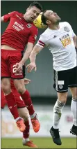  ??  ?? HIGH FLYERS: Cowie (left) tangles with Ayr United’s Moffat