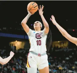  ?? MARY ALTAFFER/AP ?? South Carolina center Kamilla Cardoso puts up a shot against Indiana during the first quarter of a Sweet Sixteen game Friday in Albany, New York.