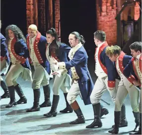  ??  ?? Lin-manuel Miranda, center, and the cast of “Hamilton” perform at the Tony Awards in New York. Many academics argue the onstage portrait of Alexander Hamilton is a counterfei­t. EVAN AGOSTINI/INVISION/AP