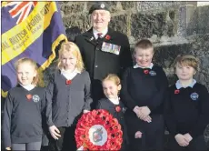  ?? 16_T44_easdale01-remembranc­e ?? Easdale branch of the Royal British Legion standard bearer Donny Reynolds paid a visit to Easdale Primary School this week.
