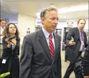  ?? GETTY IMAGES ?? Sen. Rand Paul, R-Ky., walks to the Capitol on Wednesday in Washington. Paul’s plan to repeal the health law without a replacemen­t was rejected in the Senate.