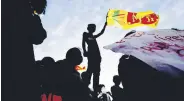  ?? ?? A demonstrat­or holding the Sri Lankan national flag is silhouette­d, Colombo, Sri Lanka, April 15, 2022.