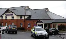  ??  ?? Suicide theory: Police at the Greenock Premier Inn