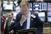  ?? RICHARD DREW — THE ASSOCIATED PRESS ?? Trader Luke Scanlon works on the floor of the New York Stock Exchange, Tuesday. Banks and technology companies took U.S. stocks higher.