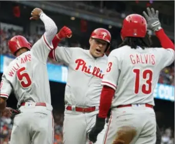  ?? MATHEW SUMNER — THE ASSOCIATED PRESS ?? Young outfielder­s Rhys Hoskins, center, and Nick Williams, left, have proven they belong in the major leagues this summer. Had the Phillies realized that sooner, Jack McCaffery believes, the trajectory of a difficult season might have changed.