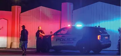  ?? GIORGIO VIERA/GETTY IMAGES ?? A police car Monday outside the Mar-a-Lago estate of former President Donald Trump, who said his residence in Florida was being “raided” by FBI agents.