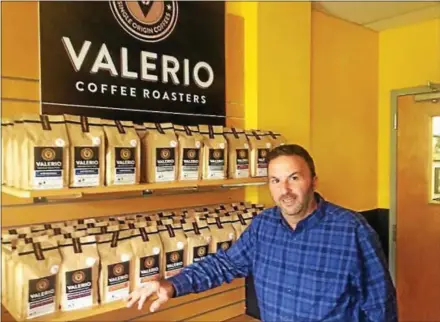  ?? GARY PULEO — DIGITAL FIRST MEDIA ?? Anthony Valerio showcases the new Valerio Coffee Roasters line at the roasting facility’s retail store in Audubon.