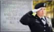  ?? MiCHAel HolAHAN/tHe AUGUStA CHRoNiCle ViA AP ?? Sgt. First Class Jasmin Harvey, of the Fort Gordon color guard, salutes during the playing of the national anthem during a Veteran’s Day observance at the All Wars Monument in Augusta, Ga., Wednesday afternoon.