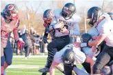  ?? GARY MIDDENDORF/ DAILY SOUTHTOWN ?? Oak Forest’s Tyler Gentile squeezes through traffic for a touchdown during Friday’s game.