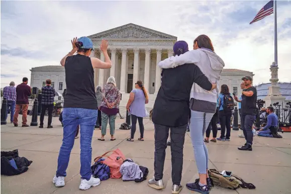  ?? J. SCOTT APPLEWHITE/AP ?? Anti-abortion activists rally outside the Supreme Court in October 2021.