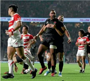  ??  ?? England’s Joe Cokanasiga celebrates a debut try in the 35-15 win over Japan at Twickenham.