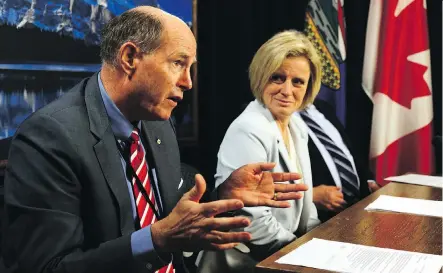  ?? PERRY MAH ?? David Dodge, former governor of the Bank of Canada and Premier Rachel Notley speak on the developmen­t of a new infrastruc­ture plan during a news conference at the legislatur­e on Thursday.