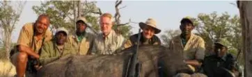  ?? ?? Profession­al hunters pose with a buffalo that they had killed