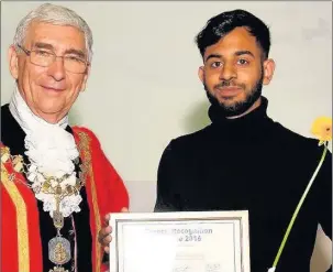  ??  ?? n PRAISE: The then-Mayor of Hillingdon, Cllr George Cooper, presents carer Ahmed Siddiqui with his award