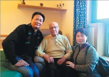  ??  ?? Author Xu Feng (left) in Belgium in 2018 interviewi­ng the only living survivor, named Morris, among the people that Madame Perlinghi-Tsien, or Qian Xiuling, helped rescue during World War II.