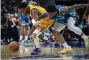  ?? MATT KELLEY — THE ASSOCIATED PRESS ?? Utah Jazz guard Trent Forrest, left, and Charlotte Hornets forward Miles Bridges chase the ball during the first half Friday in Charlotte, N.C.