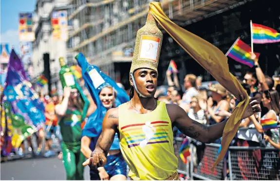  ??  ?? Up to 30,000 people joined the annual Pride in London parade yesterday, with about one million thought to be lining the streets to watch. Organisers said they hoped ‘all the rainbows... will work their magic and send good vibes over to Russia’ where...