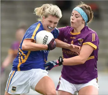  ??  ?? Róisín Murphy tries to halt the progress of Tipperary’s Jennifer Grant.