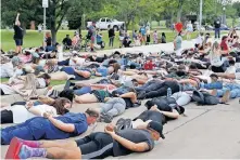  ?? [SARAH PHIPPS/ THE OKLAHOMAN] ?? Protesters lie face down outside the Norman Police Department in response to the death of George Floyd.