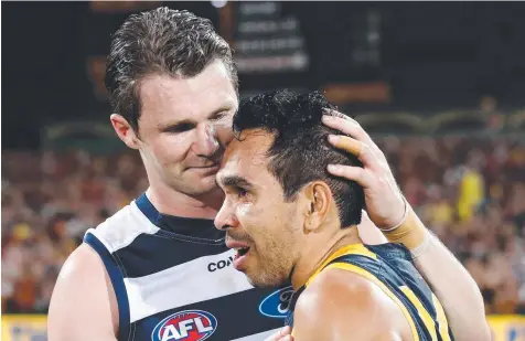  ??  ?? WELL DESERVED: Patrick Dangerfiel­d of the Cats congratula­tes former Crows teammate Eddie Betts on their preliminar­y final win.