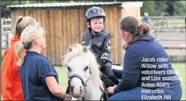  ??  ?? Jacob rides Willow with volunteers Olivia and Lisa assisting Arden RDA’s instructor, Elizabeth Hill