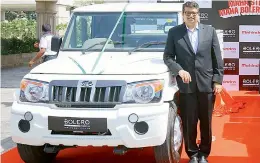  ??  ?? M&amp;M vice president — marketing (commercial vehicles) — Mahesh Kulkarni poses with the new edition of Mahindra Bolero Pick Up in Hyderabad on Friday.