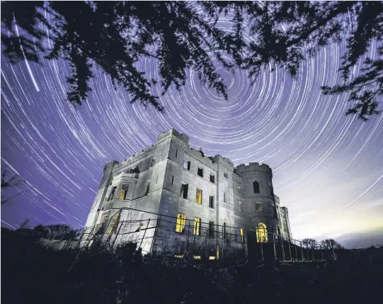  ??  ?? Starry eyed This stunning image of star trails over Dalquharra­n Castle was captured by Ayrshire Post photograph­er Alasdair MacLeod. Completed in 1790, the beautiful castle now lies abandoned but was caught in all its atmospheri­c glory by our ace snapper.