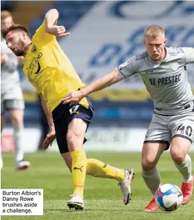  ??  ?? Burton Albion’s Danny Rowe brushes aside a challenge.