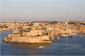  ?? (Darrin Zammit Lupi/Reuters) ?? A BOAT SAILS past the medieval Fort Saint Angelo in Vittoriosa, in Valletta’s Grand Harbor, Malta. The tiny Mediterran­ean country has become a hub for the thriving European online gambling industry, which includes online sports betting, Web-based...