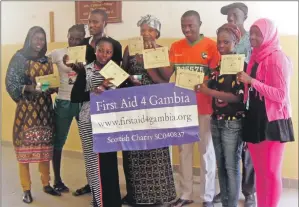  ??  ?? Newly first aid-trained participan­ts show off their certificat­es after taking part in one of the charity’s training days.