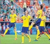  ?? REUTERS ?? Sweden's Albin Ekdal, Gustav Svensson and Mikael Lustig celebrate thumping Mexico 30 at Ekaterinbu­rg Arena.