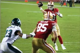  ?? RANDY VAZQUEZ — BAY AREA NEWS GROUP, FILE ?? Quarterbac­k C.J. Beathard (3) tries to throw a pass to George Kittle (85) for a two-point conversion versus the Eagles during their game on Oct. 4 at Levi’s Stadium.